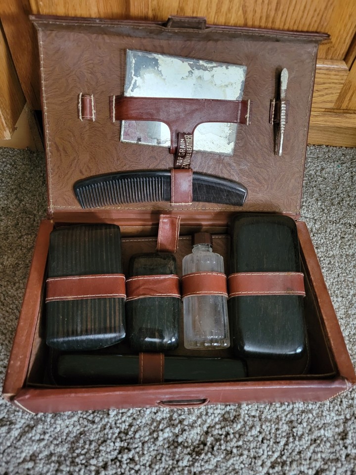 A genuine 1950s leather men's travel grooming kit — the kind of well-crafted, Mad Men-era accessory that makes modern toiletry bags look embarrassing.
