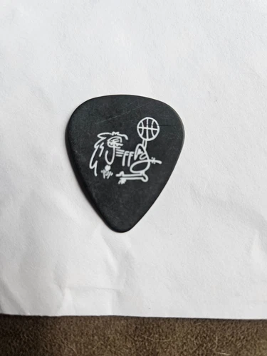 Image: https://i.ebayimg.com/images/g/S34AAOSw0dJoTvsm/s-l500.webp Pearl Jam pick Jeff Ament Pick Black Jeff DoodlePearl Jam pick - Picture 1 of 2