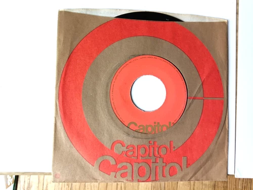 vinyl 45.   Beatles, And I Love Her.  ERROR.  one side label is blank, no print.