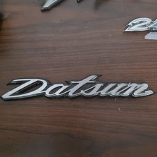 1970-78 Nissan Datsun 240z 260z 280z S30 Genuine Hatch Decklid Emblem 1970-78 Nissan Datsun 240z 260z 280z S30 Genuine Hatch Decklid Emblem