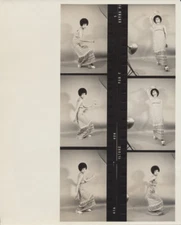 1960S CONTACT SHEET OF AFRICAN AMERICAN WOMAN W/ LARGE AFRO   BEAUTIFUL CLOTHING