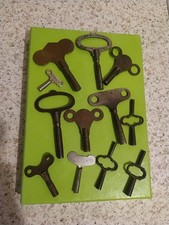Antique collection of brass clock keys