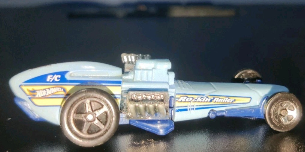 2023 HOT WHEELS ROCKIN' RAILER BLUE 1:64 DIECAST 3 1/8" CAR WITH YELLOW & CHROME
