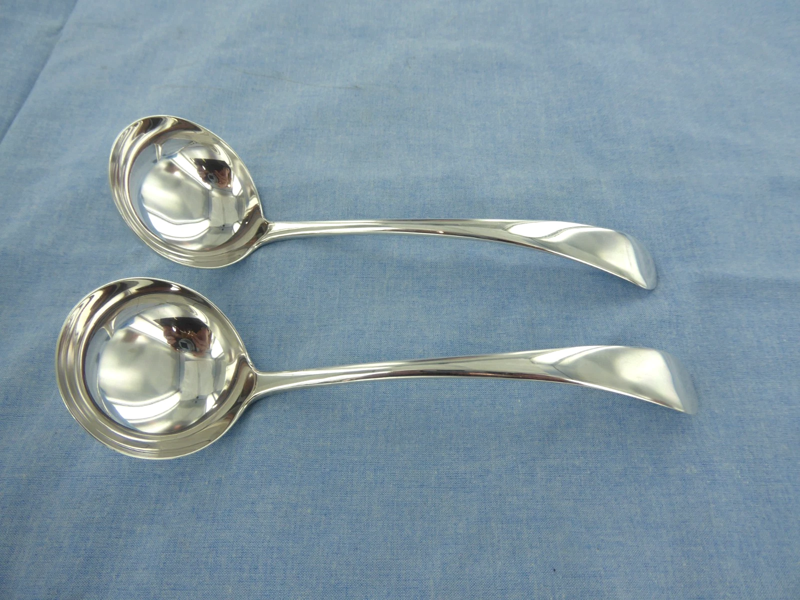 A VINTAGE PAIR OF STERLING SILVER, OLD ENGLISH SAUCE LADLES. LONDON 1936.
Opens in a new window or t