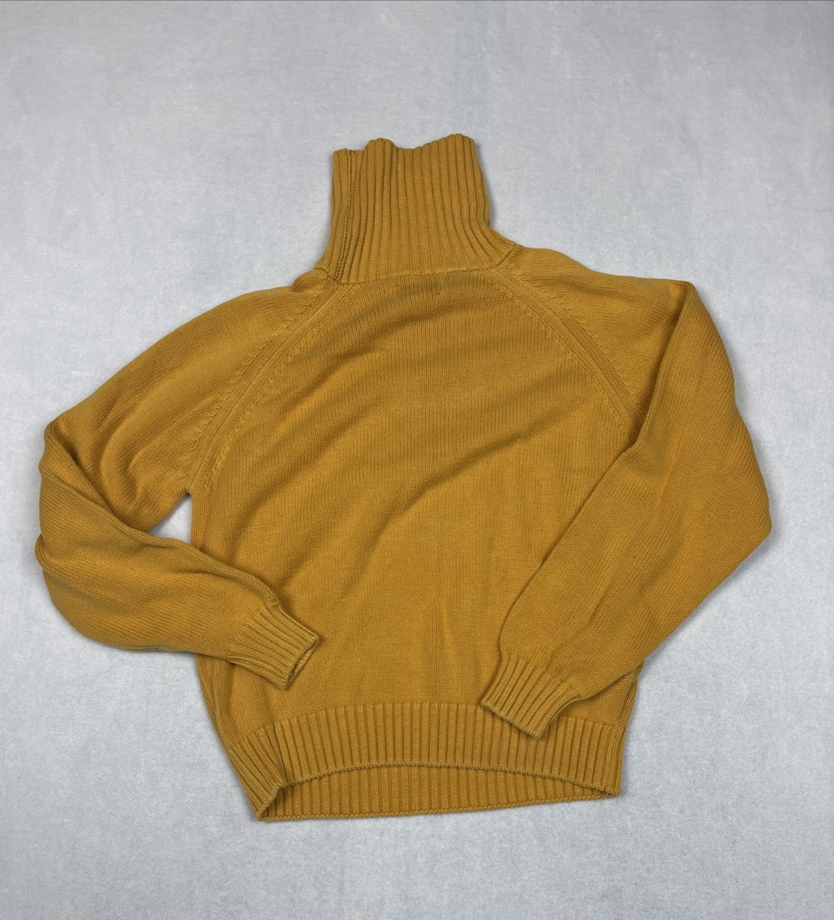 Mustard gold Lands End VTG pullover sweater with long sleeves, ribbed cuffs, and hem, laid flat on a light gray surface.