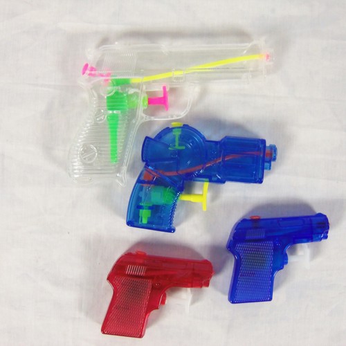 lot of 4 mini water squirt gun pistols