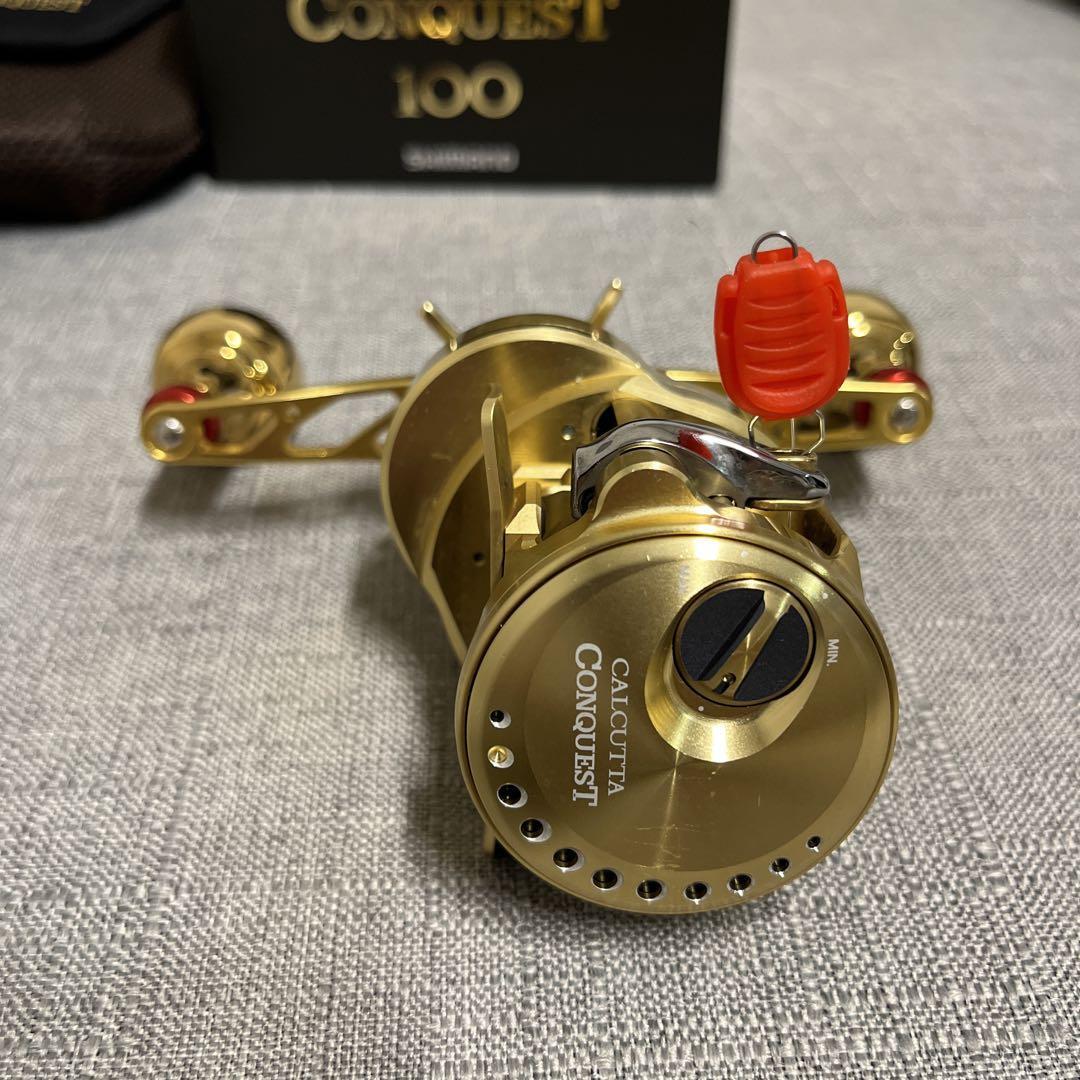 Shimano Calcutta Conquest 100 Fishing Reel - Gold - Case Shimano Calcutta Conquest 100 Fishing Reel - Gold - Case