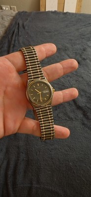 Seiko Quartz Men's Analog Black Dial Day/Date Two-Tone Bracelet 34mm 30m
