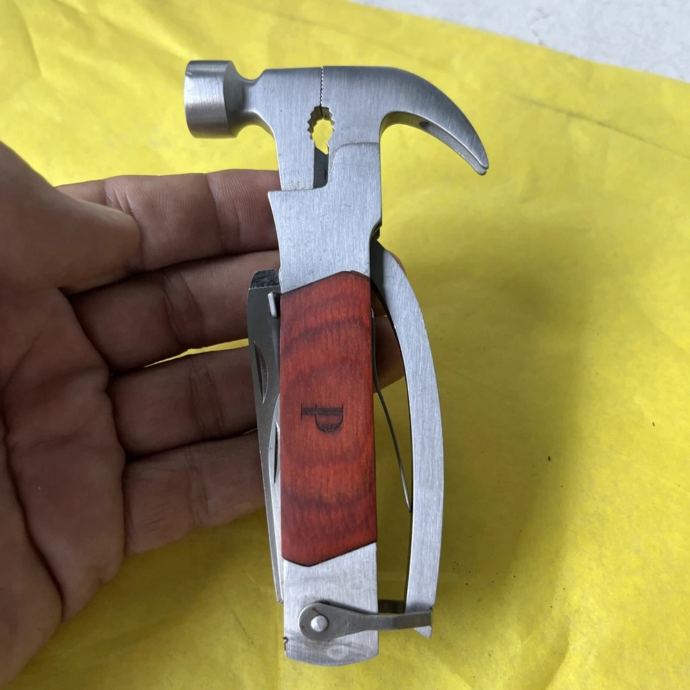 Compact Unbranded Multi-Tool with Knife, Saw, Hammer, Pliers & Bottle Opener (t11)