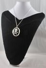 & crossbones cameo, matching necklace Silver-plated engraved oval locket, skull