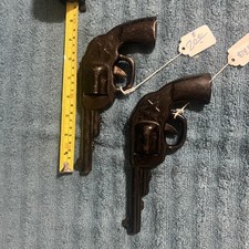 Antique Metal Clicker toy guns pair