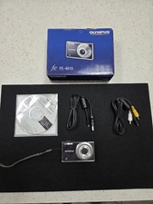 Olympus FE-4010 digital camera box featuring a 12-megapixel sensor and 4x Zoom