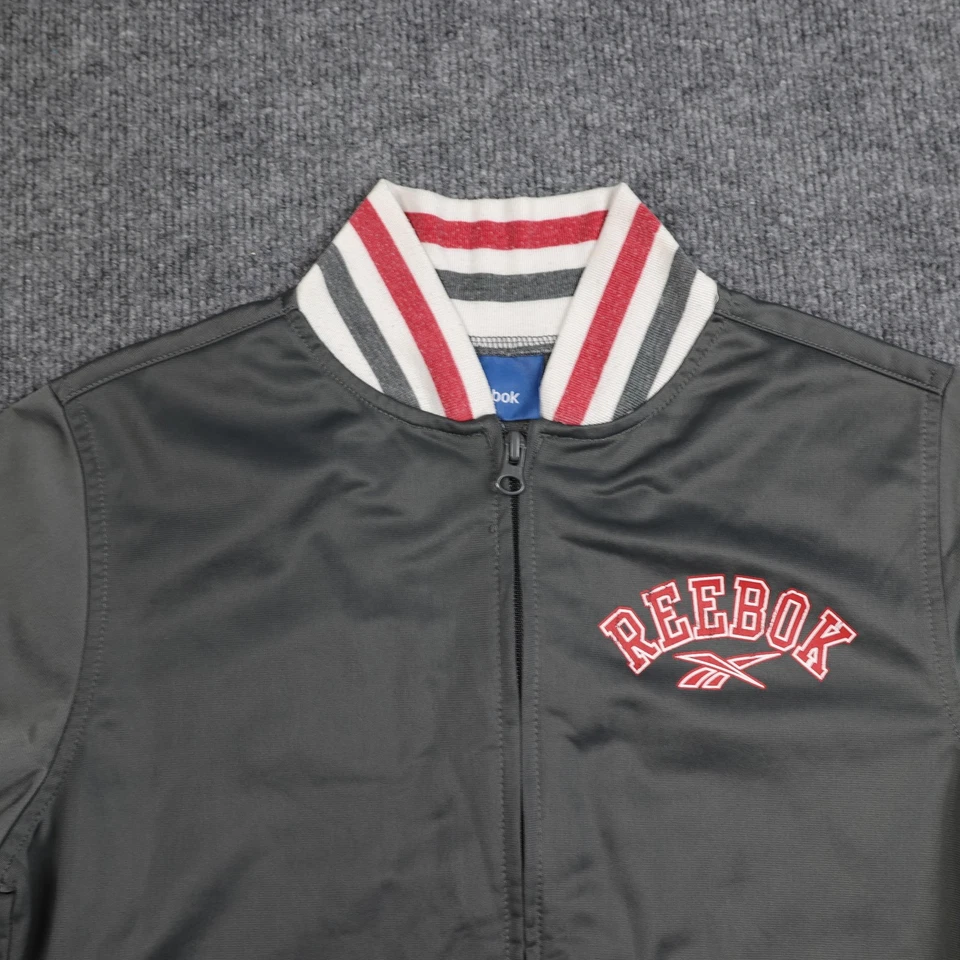 Chaqueta Reebok Juvenil Grande Gris Pista Cremallera Completa Cuello a Rayas Puños Acanalado Logo Foto 4 de 4