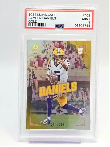 JAYDEN DANIELS 2024 LUMINANCE ROOKIE GOLD COMMANDERS RC /299 PSA 9 Q0004