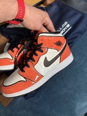 Jordan Air Jordan 1 Mid Orange White Black Mid Top Men's Athletic Sneakers