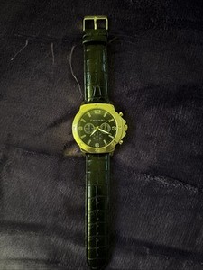 Authentic mens Tahari watch, black leather wristband, gold plated face, steal