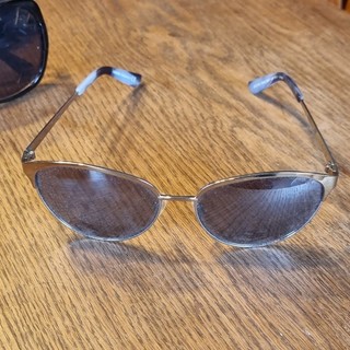 Mexx Damen Sonnenbrille oval goldener Metallrahmen & graue Gläser