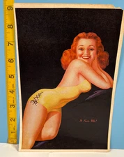 Vintage Red headed Beauty in yellow Bathing suit Pinup Calendar top.