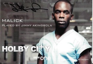 JIMMY AKINGBOLA (HOLBY CITY BEL AIR) GENUINE HAND SIGNED COL CAST PHOTO.
