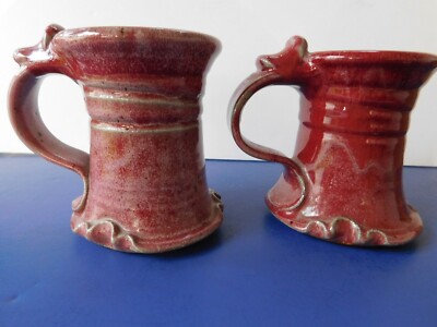 TWO POTTERY GLAZED MUGS ONE IS ABIT SMALLER THAN OTHER SIGNED ON BOTTOM