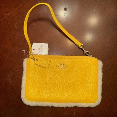 NWT COACH Small Pebbled Leather Wristlet  Shearling Trim Banana Yellow F64709