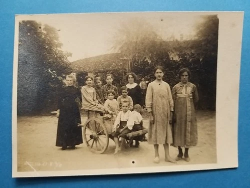 Mezzano (Parma). Antique and Rare Photo Postcard (1914). Women children in the yard.