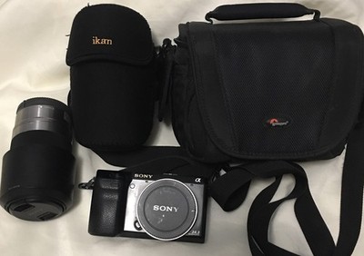 Sony NEX-7 24.3 MP Mirrorless Digital Camera With 55-210 mm lens, No Charger.