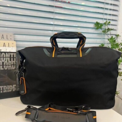 TUMI McLaren M-Tech 2way Soft Satchel Fashion Bag in Orange