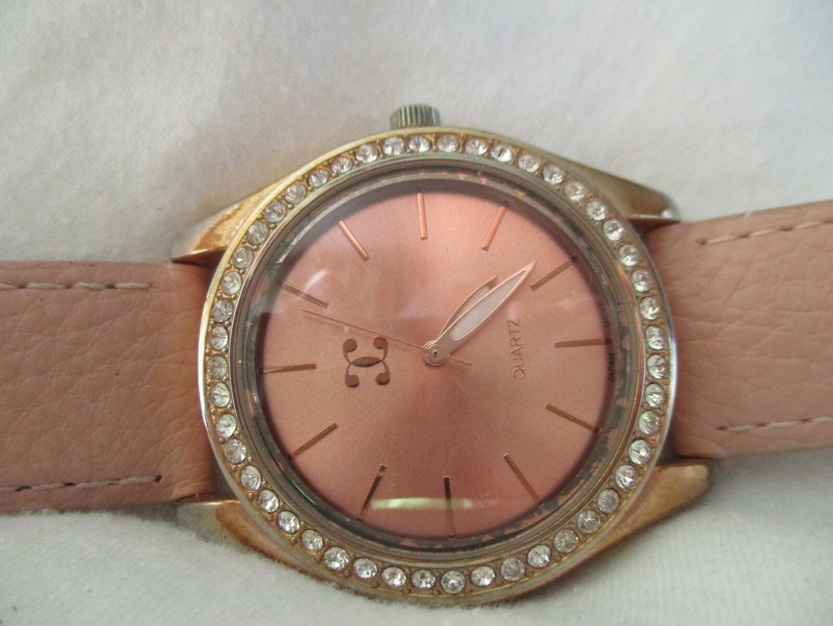 Charming Charlie Rose Gold Watch W/ Rhinestones, Quartz Movement, and White Band Charming Charlie Watch Rose Gold Toned Cuff Band Rhinestones  main image 3