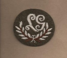 LG Trades badge on Khaki back ground British Army