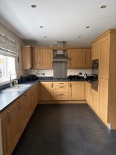 Shaker oak-effect kitchen & utility units. Work tops , including appliances.