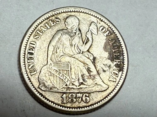 1876-S SEATED LIBERTY silver U.S. dime. VF, with a dark stain. #q1