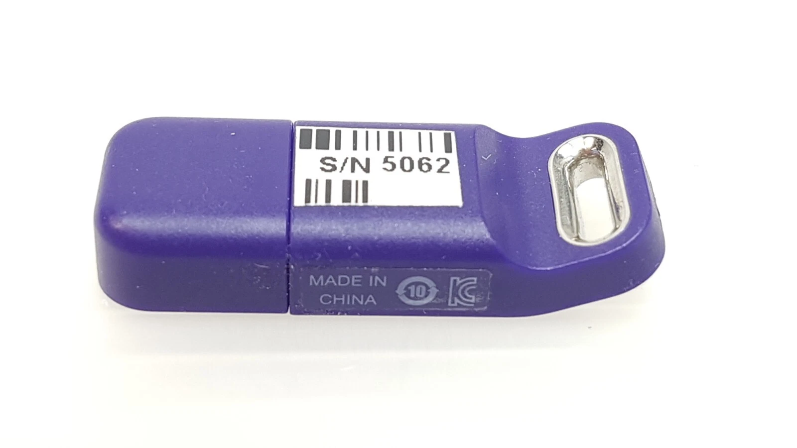 Back of the LightSheer Desire ET key with barcode label, Made in China and KC marks