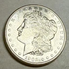 1902-O Morgan silver dollar. Satiny white choice BU $1. #le2