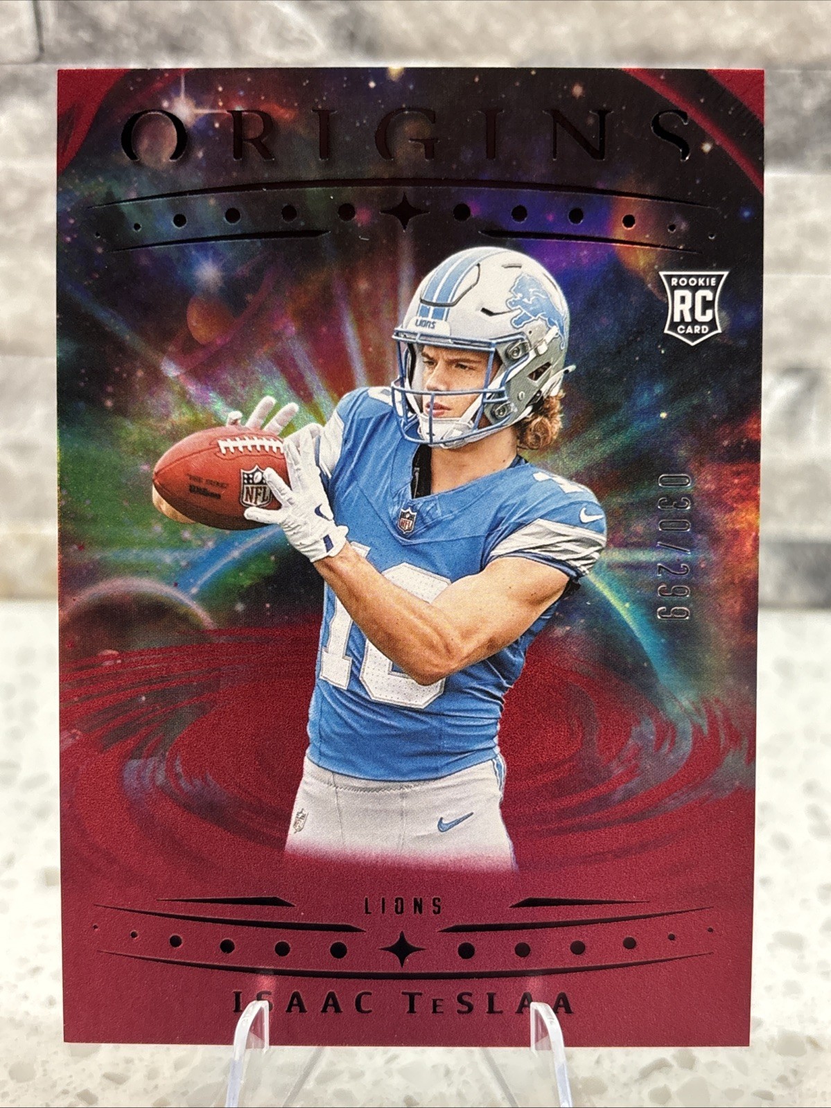 2025 Panini Origins - Rookies Isaac Teslaa Detroit Lions #118 (RC) Holo Red /299