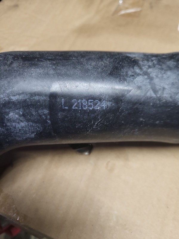 John Deere OEM Part # L218524 Upper Radiator Hose Brand New. Bag Has Slight Wear