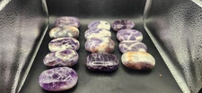 Dream amethyst palm stone! 2 too 4 ounces 2 inches long, 1.5 wide