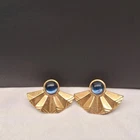 Vintage Avon gold-tone fan earrings with a blue cabochon stone costume jewelry