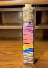 Sand colorful art in glass bottle,cork top.