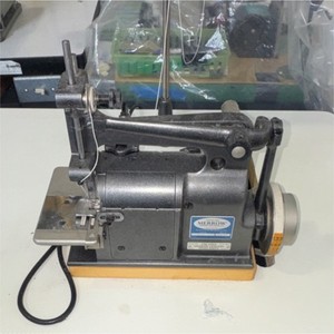 Used once Merrow 18-E Industrial crochet Sewing Machine with table and motor