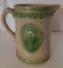 A E Hull Salt-Glazed Stoneware “Grazing Cows” Pitcher - Yellow Ware w/ Green