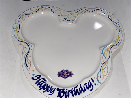 White Mickey Mouse shaped plate with “Happy Birthday!” text, colorful swirl border, and USA map design on the side.