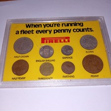 UNUSUAL VINTAGE PIRELLI ADVERTISING SET OF QUEEN ELIZABETH II COINS