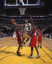 Guard Ron Artest Indiana Pacers goes for the hoop as two Los Ange- 2002 Photo