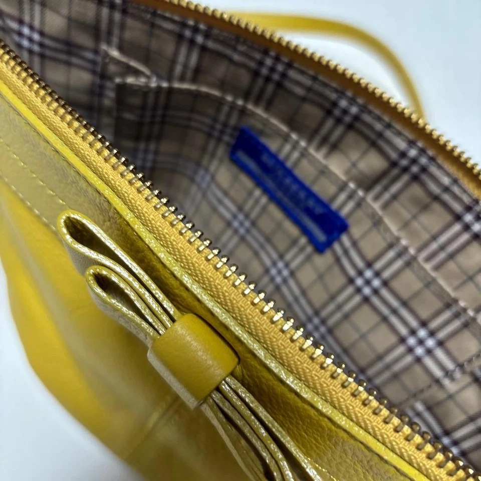 Bolso de hombro Burberry de cuero amarillo con correa ajustable casi como nuevo Foto 3 de 4