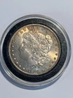 1885  $1 Morgan Silver Dollar in coin capsule uncirculated Philadelphia Mint