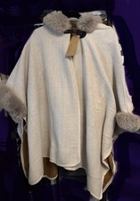Modena OS faux fur-trimmed hooded poncho in a cream color