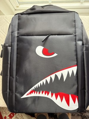 Black backpack with a shark design