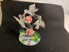 3 hummingbirds handcrafted on roses