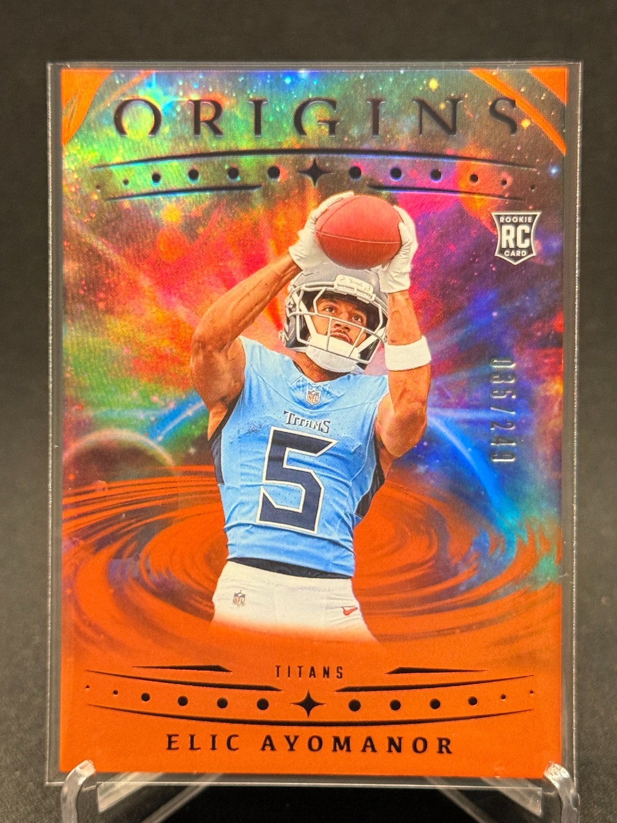 2025 Panini Origins #108 - Elic Ayomanor - Holo Orange /249 - Titans RC
